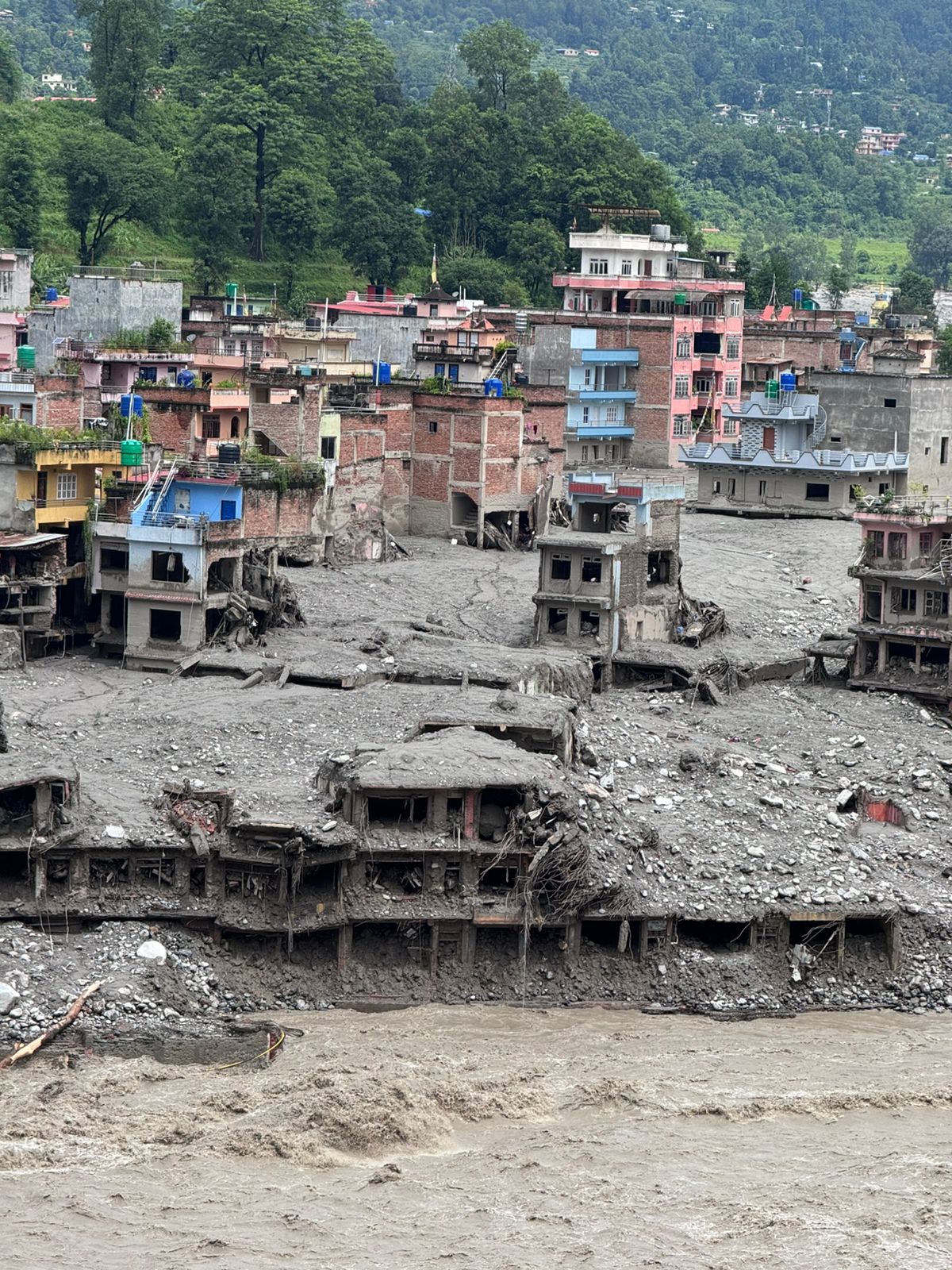 Homes filled with mud and rock after the debris flow.