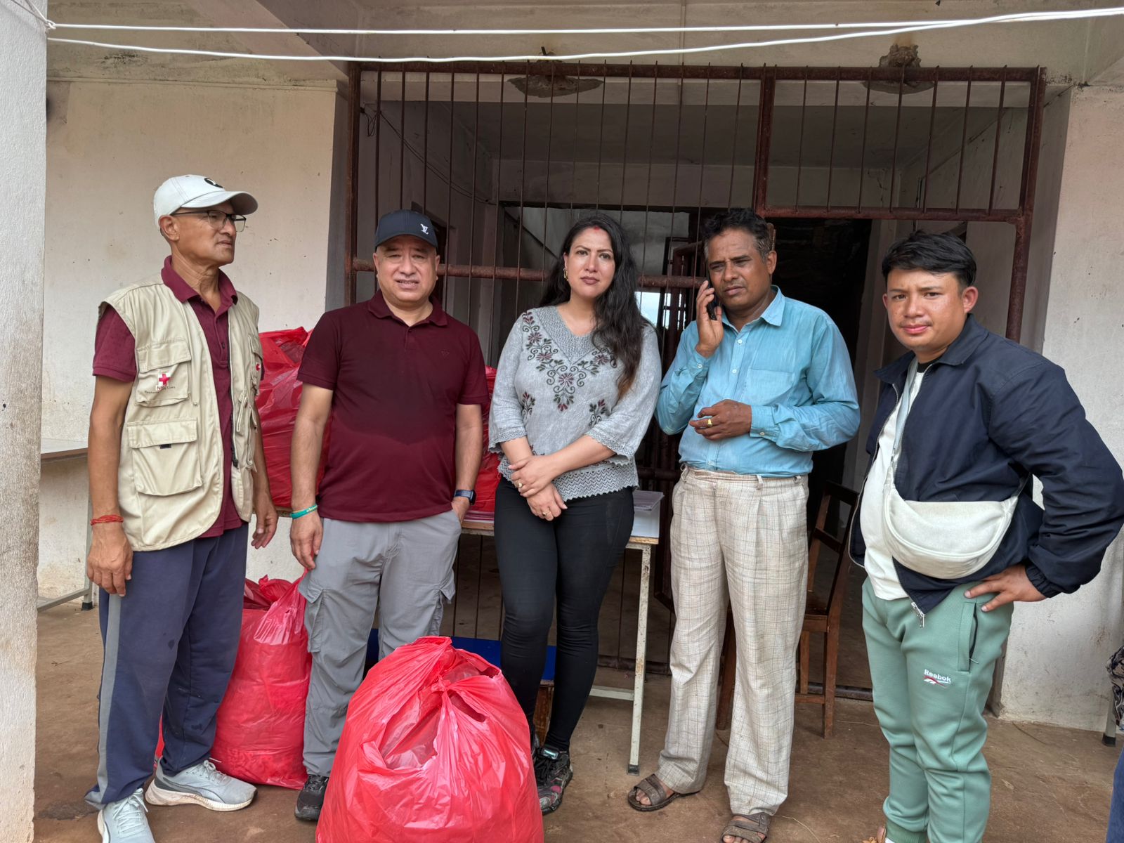 The field team with bagged relief supplies.